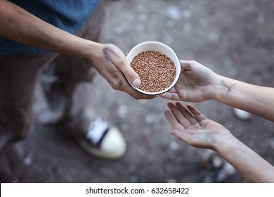 Poor Man Sharing Food With Woman