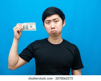 Poor Man Show Money In His Hand And Feeling Sad Emotion Blue Background