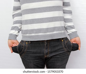 poor man showing empty pockets