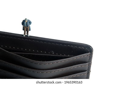 Poor Men With Empty Wallet No Money Cash. Miniature Tiny People Toys Photography. Isolated On White Background.