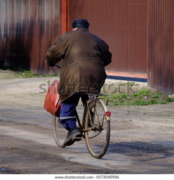 old man riding bike