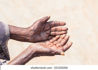 Poor People And Human Poverty Concept - Person Hands Begging For Food Or Help