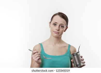 Poor Student  Eating Food From A Tin No Money For A Healthy Meal