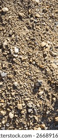 poorly sorted clastic sediments (pebbles, gravels, and sands) on the ground