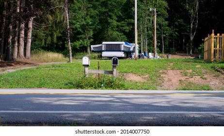 A Pop Up Camping Trailer In The Country