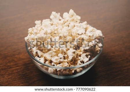 Similar – Striped box with popcorn on yellow background.