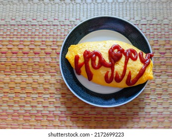 Pop Design Of The Omelet Rice With Ketchup Letters.