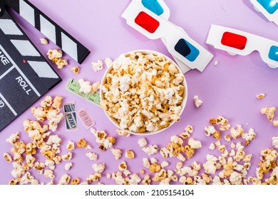 Popcorn, 3d Glasses And Movie Tickets Top View Flat Lay On Purple Solid Background