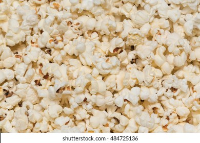 Popcorn background. Popcorn texture. Popcorn texture background. Hundreds popcorns background. High resolution, clean macro image. Close-up.
