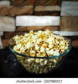 Popcorn Bowl Isolated On Blurry Background