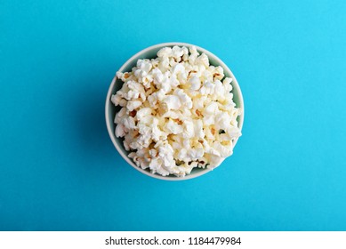 Popcorn In A Bowl On Blue Background, Top View