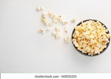 Popcorn in bowl on white background