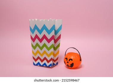 Popcorn Box With Halloween Candy Bucket On Pink Background.Horror Movie, Trick Or Treat