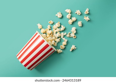 Popcorn bucket, cinema snack cardboard box, theater treat striped pack,green background - Powered by Shutterstock