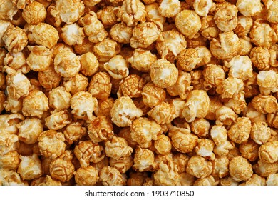 Popcorn in caramel glaze close-up as a background. Delicious praise for watching movie movies, serial, cartoon. Close-up