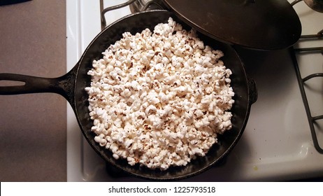 Popcorn In Cast Iron Pan On Stovetop