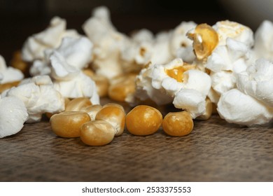 popcorn close up. popcorn with selective focus. popcorn, corn grains on a wooden table - Powered by Shutterstock