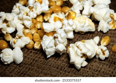 popcorn close up. popcorn with selective focus. popcorn, corn grains on a wooden table - Powered by Shutterstock