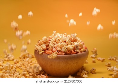 Popcorn Falling Or Pouring In To Wooden Bowl.