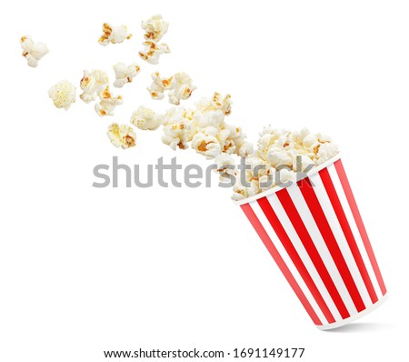 Popcorn flying out of red-white striped paper cup, isolated on white background