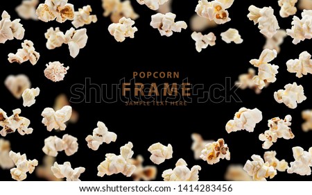 Popcorn frame with space for text, flying popcorn isolated on black background with copy space, movie poster concept