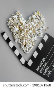 Popcorn Heart And Clapperboard On Gray Background. Copy Space. Flatlay Style. Movie Night, Film Viewing