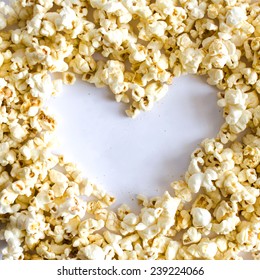 Popcorn Heart , Heart shaped frame made of popcorn over the white background