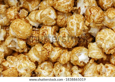 Popcorn Pattern. A pile of popcorn. Sweets. Popcorn Pattern. Caramel popcorn textured background. Food, cinema, movie. Top view. 