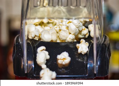 Popcorn Popping Out Of Home Electric Popcorn Machine