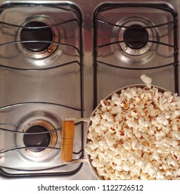 Popcorn In A Pot On Top Of A Four-burner Stove.