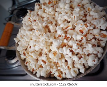 Popcorn In A Pot On Top Of A Four-burner Stove. Close Focused.