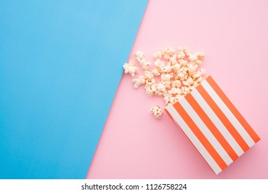 Popcorn In Red Bag On Colorful Blue Pink Background, Flatlay Still Life Minimal Style