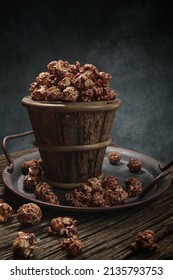 Popcorn  is a variety of corn kernel which expands and puffs up when heated, the same names also refer to the foodstuff produced by the expansion.