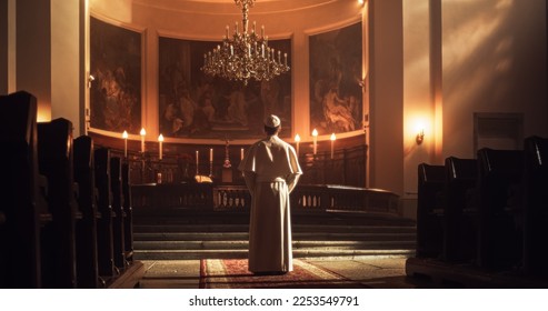 The Pope Stands at The Altar, A Figure of Reverence, Faith, Devotion. Clothed in White, Symbol Of Christianity, Holiness, God's Love. His Presence Fillswith Belief in Jesus Chirst and His Teaching - Shutterstock ID 2253549791