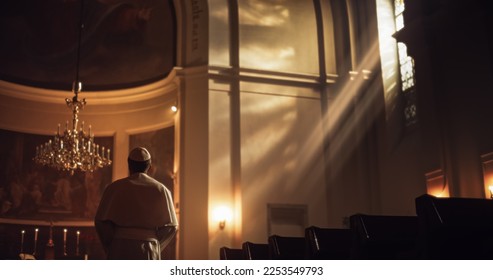 The Pope Stands at The Altar, A Figure of Reverence, Faith, Devotion. Clothed in White, Symbol Of Christianity, Holiness, God's Love. His Presence Fillswith Belief in Jesus Chirst and His Teaching - Shutterstock ID 2253549793