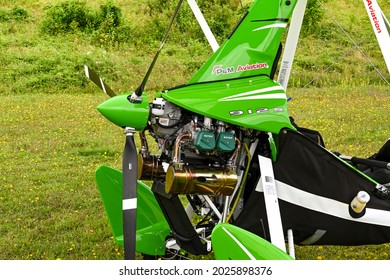 Popham, near Basingstoke, England - August 2021:Close-up view of the engine and propeller of a microlight aircraft.