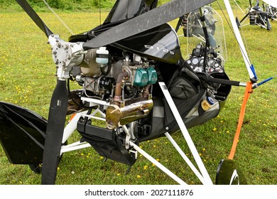Popham, near Basingstoke, England - August 2021: Close up view of the propeller and rotary engine of a microlight aircraft.