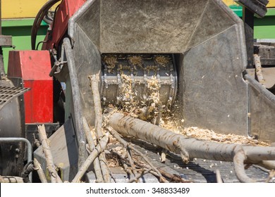 poplar trunks grinding machine to become chip - Shutterstock ID 348833489