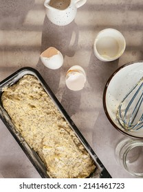 Poppy Seed Lemon Cake Dough In Baking Pan And Kitchen Equipment