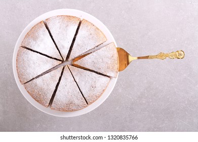 Poppy Seed Torte With Icing Sugar On Plate