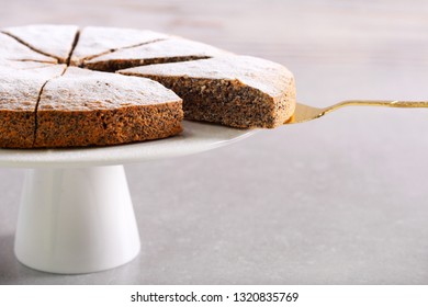 Poppy Seed Torte With Icing Sugar On Plate