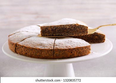 Poppy Seed Torte With Icing Sugar On Plate