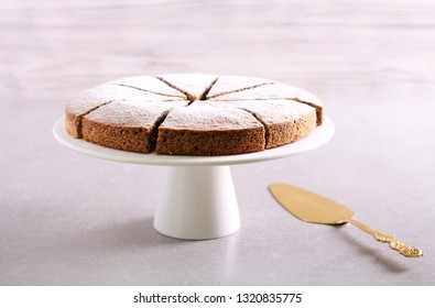 Poppy Seed Torte With Icing Sugar On Plate