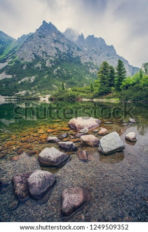 Popradske pleso - tarn in High Tatras mountains, Slovakia. Charming view of the mountains from the shore of the lake.