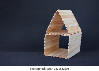 Popsicle Stick House On A Black Background