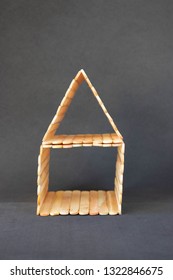 Popsicle Stick House On A Black Background