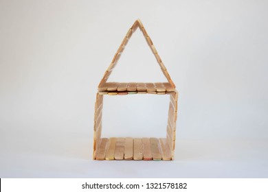 Popsicle Stick House On A White Background