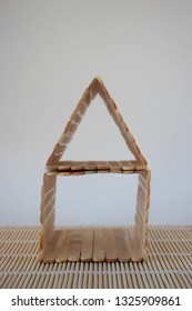 Popsicle Stick House On A White Background