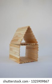 Popsicle Stick House On A White Background