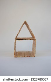 Popsicle Stick House On A White Background